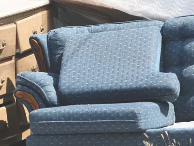 A dresser and couch for bulky collection.